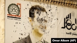 Хама провинциясындагы Башар Асаддын ок тешкен сүрөтү. 6-декабрь, 2024-жыл. 