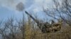 A Ukrainian serviceman fires an anti-aircraft cannon near the frontline city of Bakhmut on April 7. 