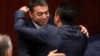 Macedonian Foreign Minister Nikola Dimitrov (left) and Prime Minister Zoran Zeav congratulate each other after the Macedonian parliament first ratified the deal in Skopje on June 20.