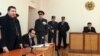 Armenia - Colonel Margar Ohanian (L), former chief of the national traffic police, speaks in a Yerevan court at the start of his his trial on corruption charges, 9Jan2012.