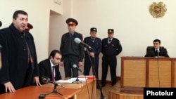 Armenia - Colonel Margar Ohanian (L), former chief of the national traffic police, speaks in a Yerevan court at the start of his his trial on corruption charges, 9Jan2012.