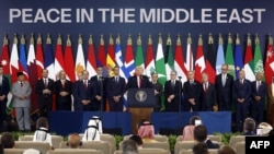 U.S. President Donald Trump (C) delivers a statement during a summit on Gaza in Sharm el-Sheikh on October 13, 2025.