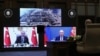 Turkish Recep Tayyip Erdogan (left) and Russian President Vladimir Putin speak during a ceremony as they remotely inaugurate construction at Turkey's Akkuyu power plant on March 10.