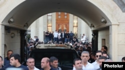 Armenia - People gather outside the Yerevan home of Russian-Armenian businessman Samvel Karapetian, June 17, 2025.
