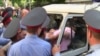 Armenia -- An opposition supporter is forced into a police vehicle near Yerevan's Liberty Square, 31May 2010.