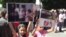 Armenia -- Armenian Yazidi children hold posters during a protest action in front of the Prime Minister's Office, Yerevan, 14 August 2014 