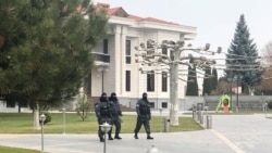 Armenia -- Masked policemen are seen outside Ruben Hayrapetian's house, Yerevan, December 13, 2019.