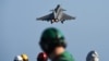 At Sea -- A French Rafale fighter aircraft takes off with bombs from the French aircraft carrier Charles-de-Gaulle, at eastern Mediterranean sea, November 23, 2015