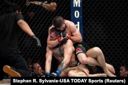 Хабиб Нурмагомедов жана Конор Макгрегор.