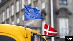 European and a Danish flags fly on a bus in Copenhagen. (File photo)