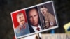 Транспарант с изображением Иосифа Сталина, Владимира Путина и Адольфа Гитлера во время одной из акций протеста против полномасштабного вторжения России в Украину, 27 февраля 2022 года