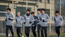 Жапония курама командасынын оюнчулары машыгуу учурунда.