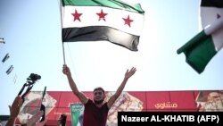 Сириянын өкмөтүнө каршы жана абактагыларды бошотууну талап кылган демонстрация. Алеппо аймагы, 28-сентябрь, 2018-жыл
