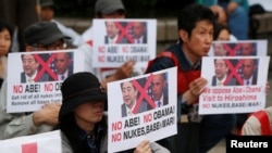 Обама менен Абэнин келишине каршылар. Хиросима, 26-май, 2016-жыл.