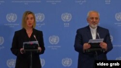 Евробиримдиктин тышкы саясат боюнча башкы комиссары Федерика Могерини жана Ирандын тышкы иштер министри Жавад Зариф.