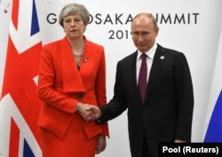 Прем’єр-міністр Великої Британії Тереза Мей і президент Росії Володимир Путін під час саміту G20 в Японії. Осака, 28 червня 2019 року