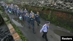 Сычуань провинциясындагы эмгек лагеринде камалгандар.