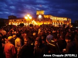 Night falls on Republic Square in Yerevan on April 19, with rings of police guarding the government building from energized protesters demanding the resignation of Prime Minister Serzh Sarkisian.