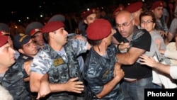Armenia - Protesters clash with riot police near the Harsnakar restaurant in Yerevan, 8Jul2012.