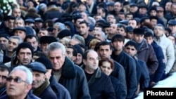 Armenia - Residents of Gyumri take part in the funeral of six members of a local family killed in their home, 15Jan2015.