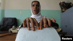 Afghanistan -- A blind student reads Braille during a lesson at a blind school in Kabul, 04Sep2012