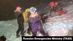 Members of the Emergency Situations Ministry conduct a rescue operation after the group of climbers got stuck on Mount Elbrus.