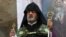 Armenia -- Archbishop Navasard Kchoyan leads a ceremony in St. Sargis Church, Yerevan, September 2, 2014.