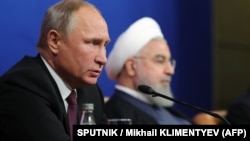 Оьрсийчоьнан президент Путин Владимир а (аьрру агIорхьара), ГIажарийчоьнан президент РоухIани Хьасан а. ТехIран, 2018