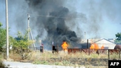 Украина --  Новоазовск шаарчасынын чет жакасындагы кагылышуулардан. 27-август, 2014