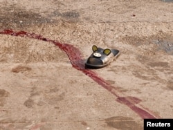 Катаал жазалоодон кийин... Янгон шаарынын чет жакасы. 2021-жылдын 27-марты.