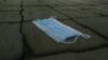 Kazakhstan. Covid-19 Medical mask lying on the sidewalk. Almaty, December 9, 2020