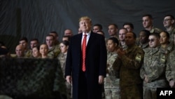 US President Donald Trump speaks to the troops during a surprise Thanksgiving day visit at Bagram airbase in 2019. 