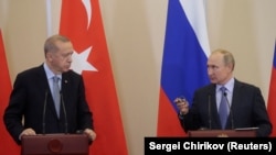 Russian President Vladimir Putin (R) and Turkish President Recep Tayyip Erdogan (L) attend a joint news conference following Russian-Turkish talks in the Black sea resort of Sochi, Russia, October 22, 2019