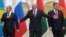 Belarus -- (L-R) Russian President Vladimir Putin, Belarusian President Alyaksandr Lukashenka and Ukrainian President Petro Poroshenko react while posing for a family photo during their meeting in Minsk, August 26, 2014