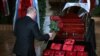 Russian President Vladimir Putin pays his respects to Vladimir Zhirinovsky during a memorial service in Moscow on April 8.