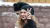 Maria Alyokhina flashes a V-sign as she arrives for a court hearing in Moscow in March 2021.