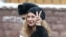 Maria Alyokhina flashes a V-sign as she arrives for a court hearing in Moscow in March 2021.