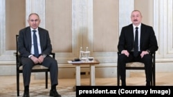 UAE -- Azerbaijani President Ilham Aliyev and Armenian Prime Minister Nikol Pashinian meet in Abu Dabi, July 10, 2025.