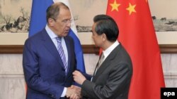Китайн а, Оьрсийчоьнан а арахьарчу г1уллакхийн министрш Йи Ванг а, Лавров Сергей а. Охан15, 2014