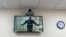 Russian opposition leader Aleksei Navalny is seen on a screen via a video link during a court hearing in June.