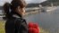 A woman mourns during memorial ceremonies to commemorate the 10th anniversary of the Kursk disaster in the submarine’s home base of Vidyayevo on August 12, 2010.