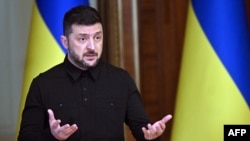 Ukraine's President Volodymyr Zelensky reacts as he holds a joint press-conference following talks with High Representative of the European Union for Foreign Affairs and Security Policy in Kyiv on October 13, 2025, amid the Russian invasion in Ukraine.