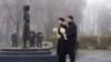 Ukrainian President Volodymyr Zelenskyy and first lady Olena Zelenska visit a monument to Holodomor victims in Kyiv on November 22. 