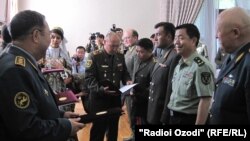 Military officials gather in Tajikistan ahead of the exercises on June 8.