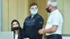Azerbaijan - Armenian prisoner Viken Euljekian (center) stands trial in Baku, June 8, 2021.