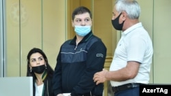 Azerbaijan - Armenian prisoner Viken Euljekian (center) stands trial in Baku, June 8, 2021.