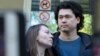 Dmitry Prokazov (right) and his wife, Olga, speak to press after a court session in Moscow on August 28.