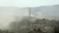 Syria -- Smoke above buildings following what Syrian rebels claim to be a toxic gas attack by pro-government forces in eastern Ghouta, on the outskirts of Damascus, August 21, 2013