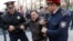 KAZAKHSTAN -- Police officers detain an anti-government protester during a rally in Almaty, Kazakhstan March 22, 2019. 