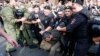 A supporter of Aleksei Navalny is detained by police in central Moscow on July 18.